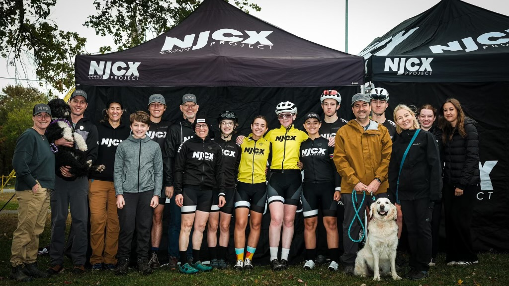 NJCX team and families gathered under the team tent